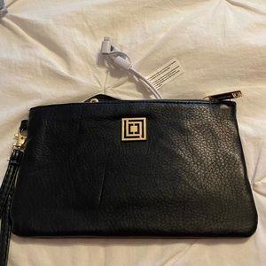 Cell phone wallet- has charger.